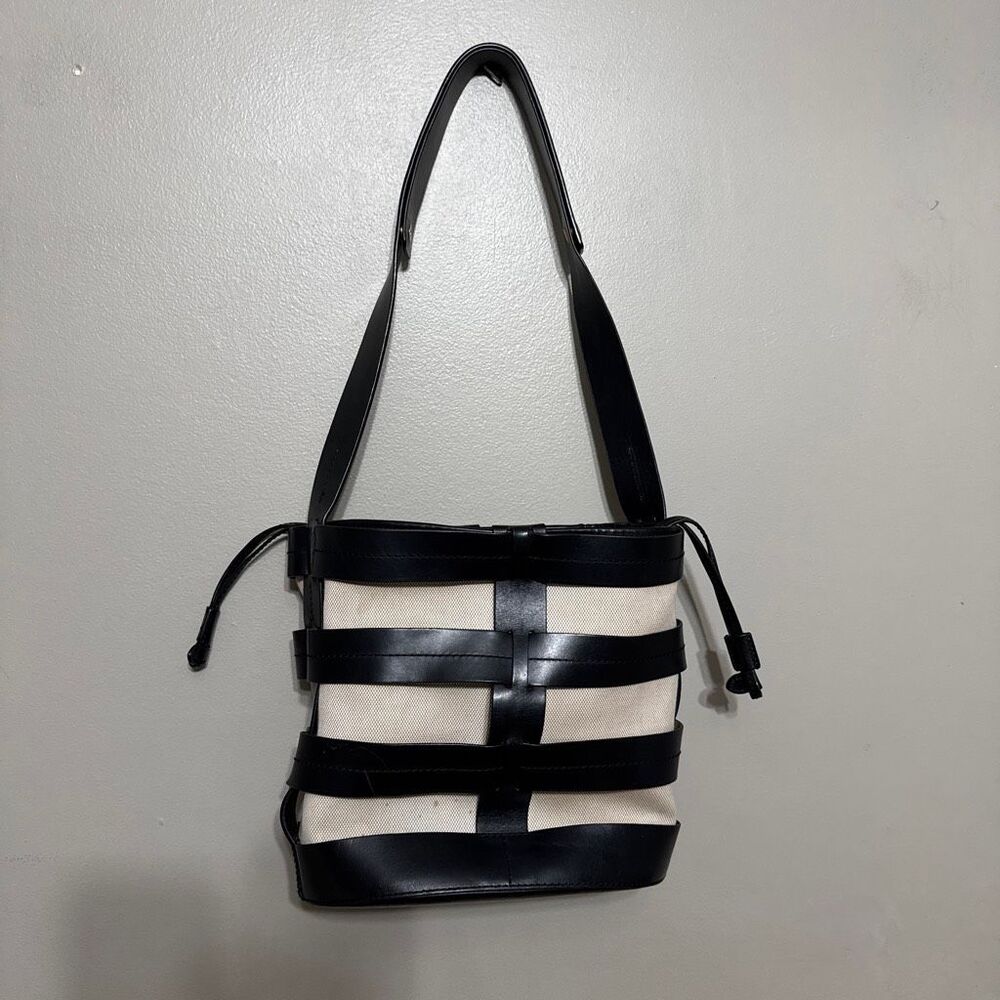Trademark black leather canvas Hesse bucket bag